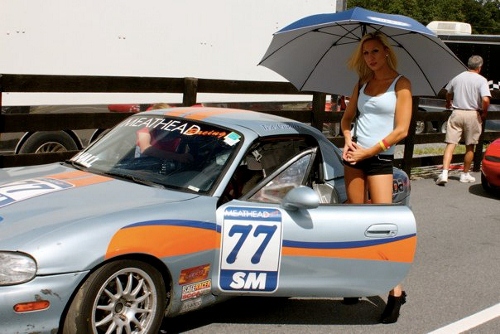 Ted and an umbrella girl before the race